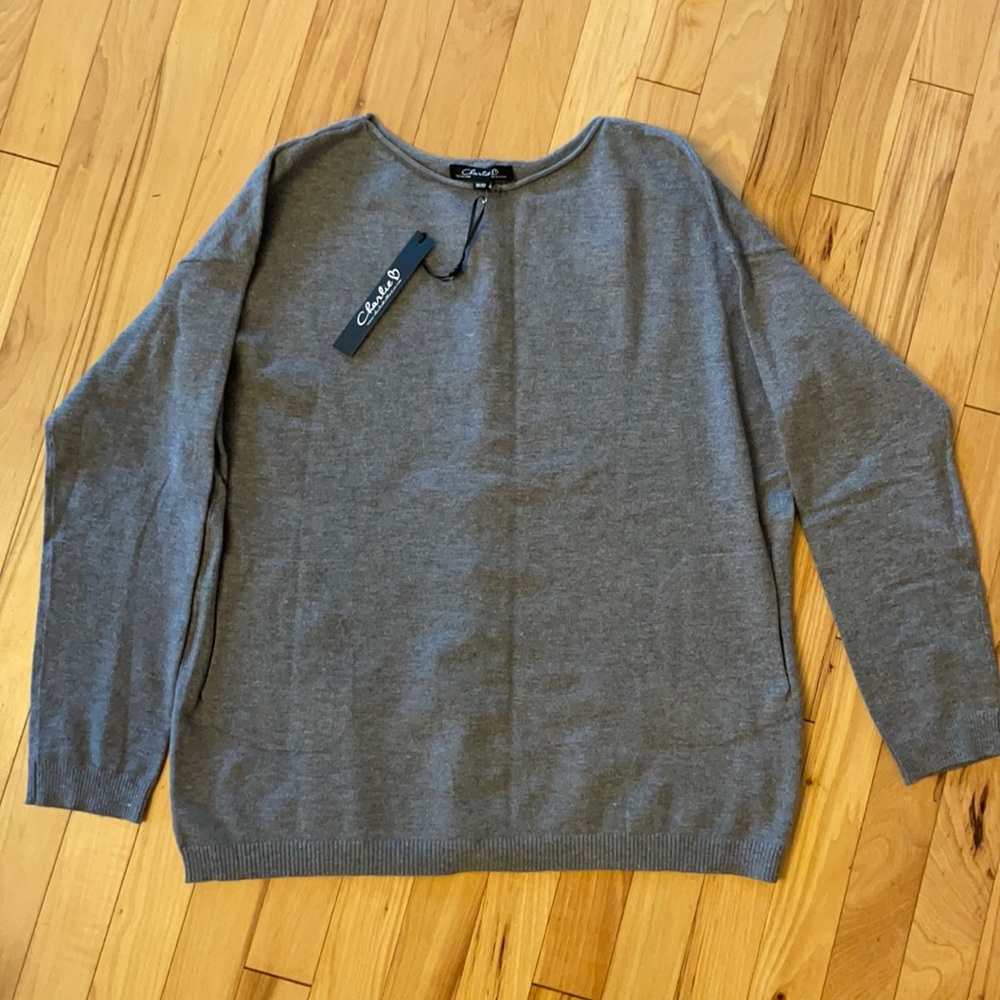BNWT. Adorable and soft grey sweater with pearl accents down the back